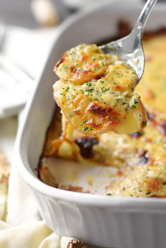 <p>Simple Seasonal</p><p>Achieve scalloped potato perfection with this cheesy, lightly herbed recipe that elevates this staple dish to new heights!</p><p><strong>Get the recipe: <a href="https://simpleseasonal.com/recipes/meal-types/sides/cheddar-parmesan-scalloped-red-potatoes" rel="nofollow noopener" target="_blank" data-ylk="slk:Cheddar Parmesan Scalloped Red Potatoes;elm:context_link;itc:0;sec:content-canvas" class="link rapid-noclick-resp">Cheddar Parmesan Scalloped Red Potatoes</a></strong></p>