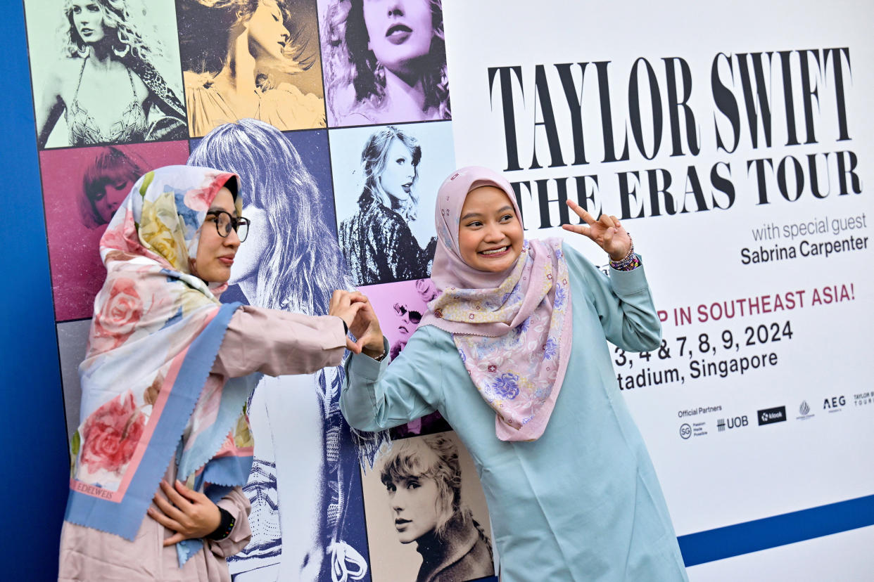 Taylor Swift's fans pose for a picture at the Singapore Sports Hub during Swift's Eras Tour concert in Singapore.