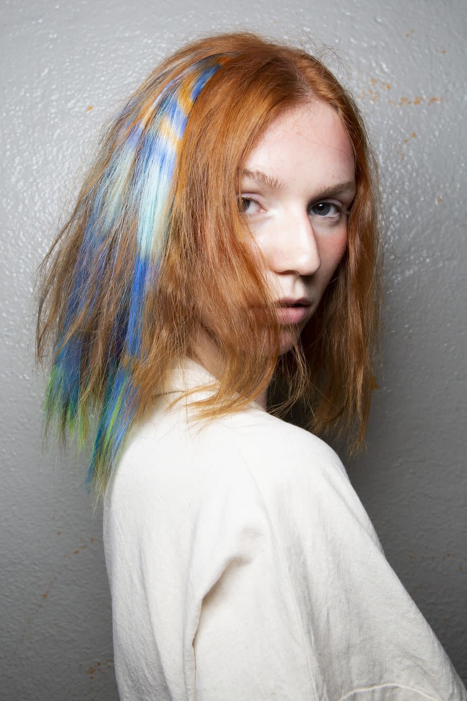 <p>Hairstylist Kien Hoang for Oribe used tie-dyed extensions that mimic the seven chakras backstage at Collina Strada. </p>