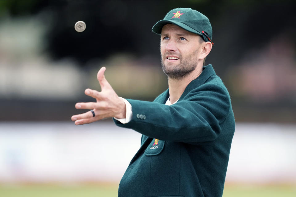 Zimbabwe captain Craig Ervine tosses the coin on the first day of the Test cricket match between Zimbabwe and West Indies at Queens Sports Club in Bulawayo, Zimbabwe, Saturday,Feb, 4, 2023. (AP Photo/Tsvangirayi Mukwazhi)