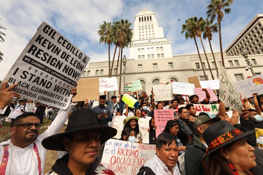 LOS ANGELES, CA - OCTOBER 15, 2022 - - Hundreds from the Oaxacan community, along with prominent leaders from indigenous communities across California, finish their March for Justice for a rally at City Hall in downtown Los Angeles on October 15, 2022. Comunidades Indigenas en Liderago (CIELO), in alliance with prominent indigenous communitv leaders across California were demanding for the immediate resignation of Los Angeles council members Gil Cedillo and Kevin de Leon after the release of a recording with racial and insensitive statements made by political officials. (Genaro Molina / Los Angeles Times)