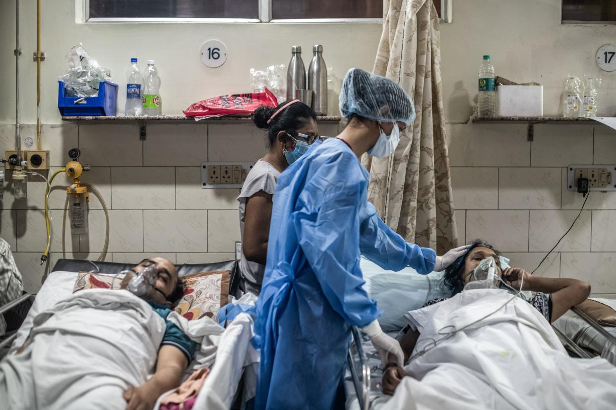 Medical staff attends to a patient who has contracted the coronavirus inside the emergency ward of a Covid-19 hospital on May 03, 2021, in New Delhi, India.