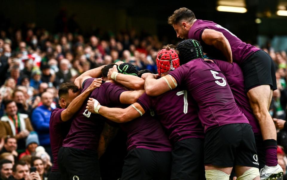 Sexton's team-mates mob him as he scored his try - GETTY IMAGES