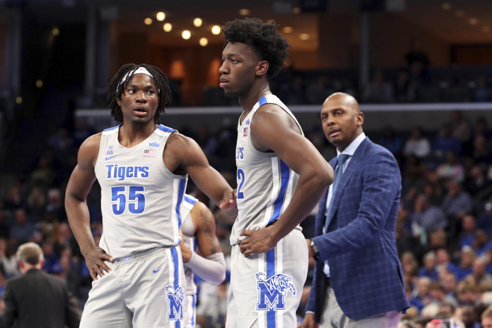 Memphis' James Wiseman (32), Precious Achiuwa (55) talk during a break during the second half of an NCAA college basketball game against Illinois-Chicago, Friday, Nov. 8, 2019, in Memphis, Tenn. (AP Photo/Karen Pulfer Focht)