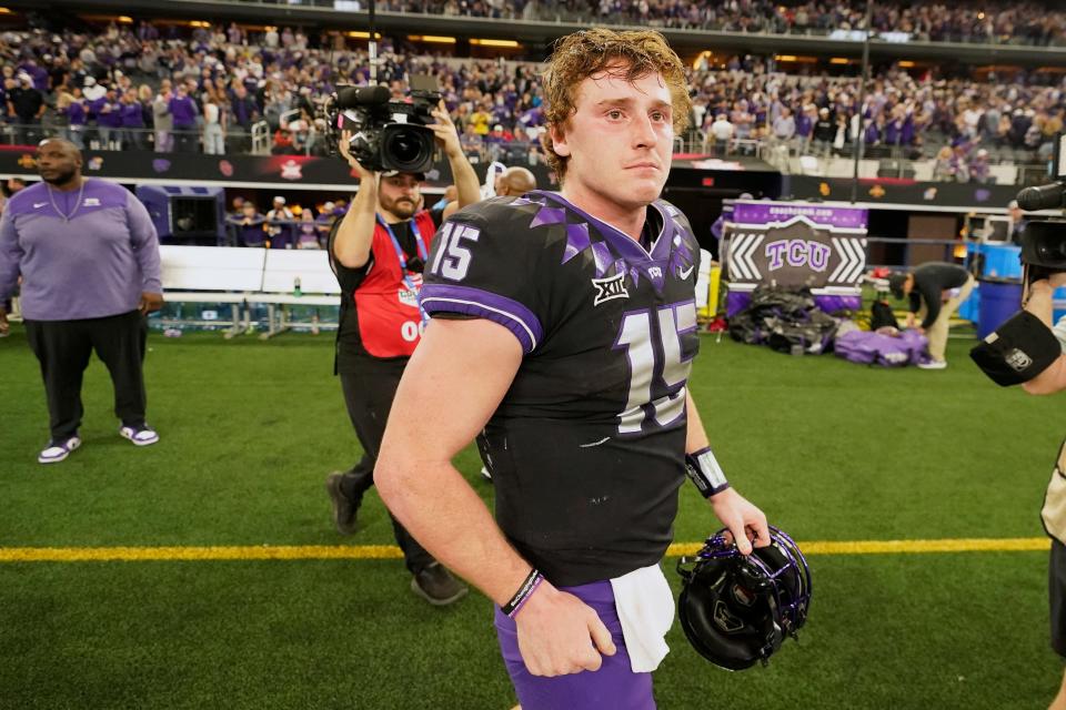 TCU quarterback Max Duggan (15) walks off the field after Kansas State defeated TCU in the Big 12 Conference championship NCAA college football game, Saturday, Dec. 3, 2022, in Arlington, Texas. (AP Photo/LM Otero)