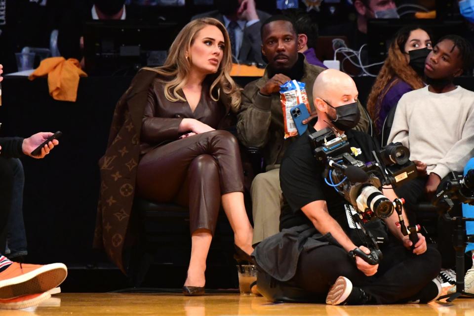 <p>Adele and boyfriend Rich Paul sit courtside at the Golden State Warriors vs. Los Angeles Lakers game on Oct. 19 at the Staples Center in L.A.</p>