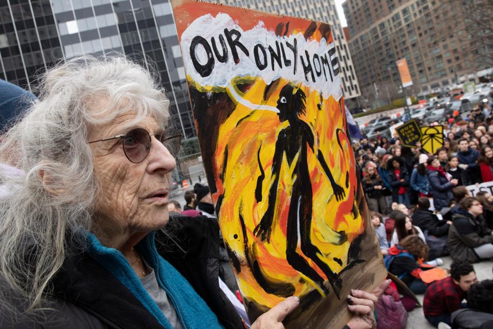 A demonstrator holds a poster during a rally in New York held to coincide with United Nations-sponsored talks on climate change.