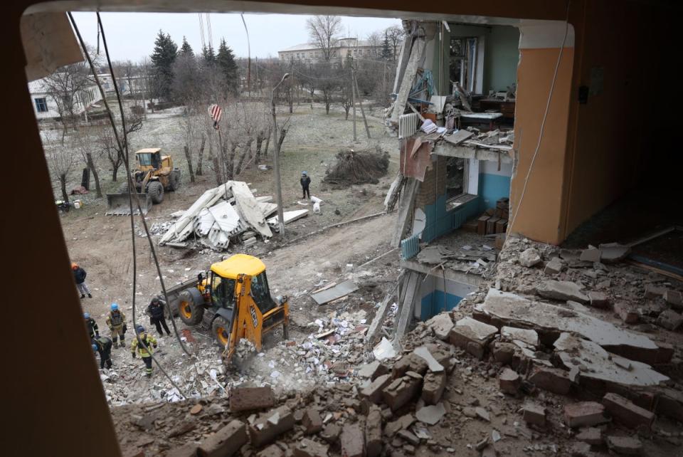 Rescuers clear debris in a hospital in Selydove damaged by a Russian missile strike (AFP via Getty Images)