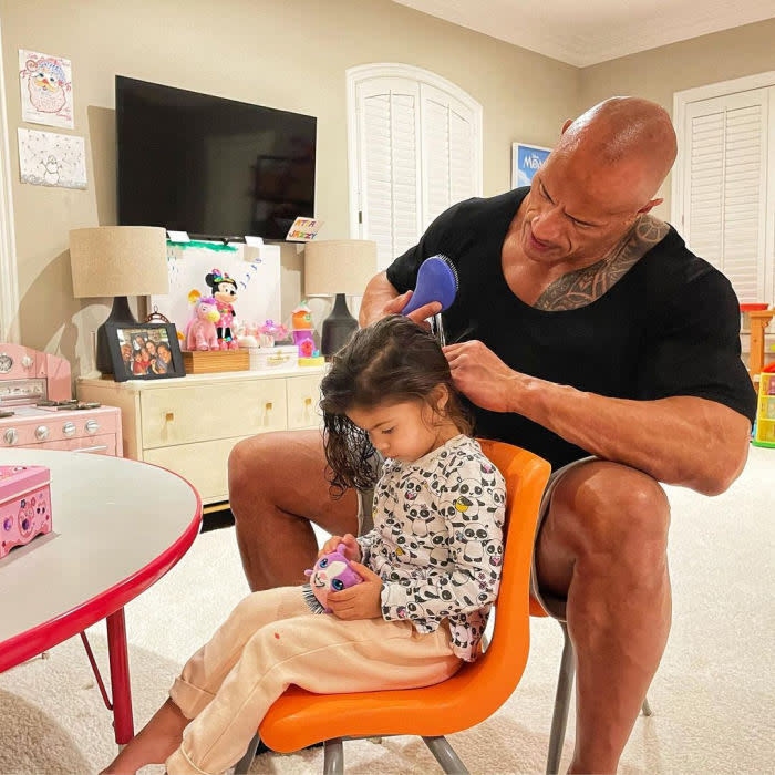 Dwayne The Rock Johnson brushes daughter Tianas hair