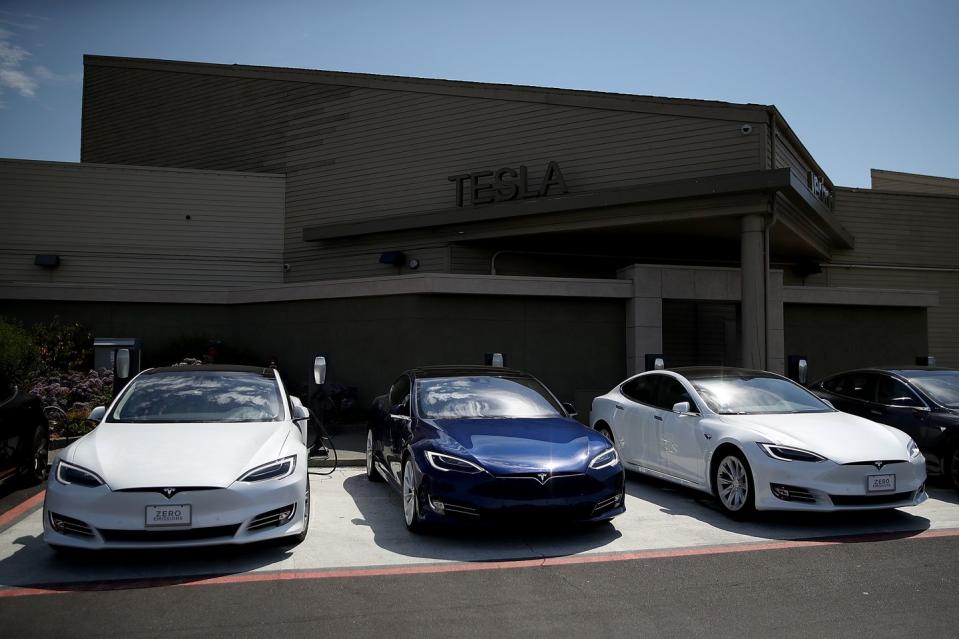 telsa reports quarterly earnings