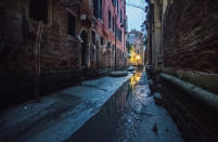 <p>Boats are stuck in low tide in a canal in Venice, Italy. An exceptional low tide affected Venice this afternoon creating problems in transport and navigation. (Simone Padovani/Awakening/Getty Images) </p>