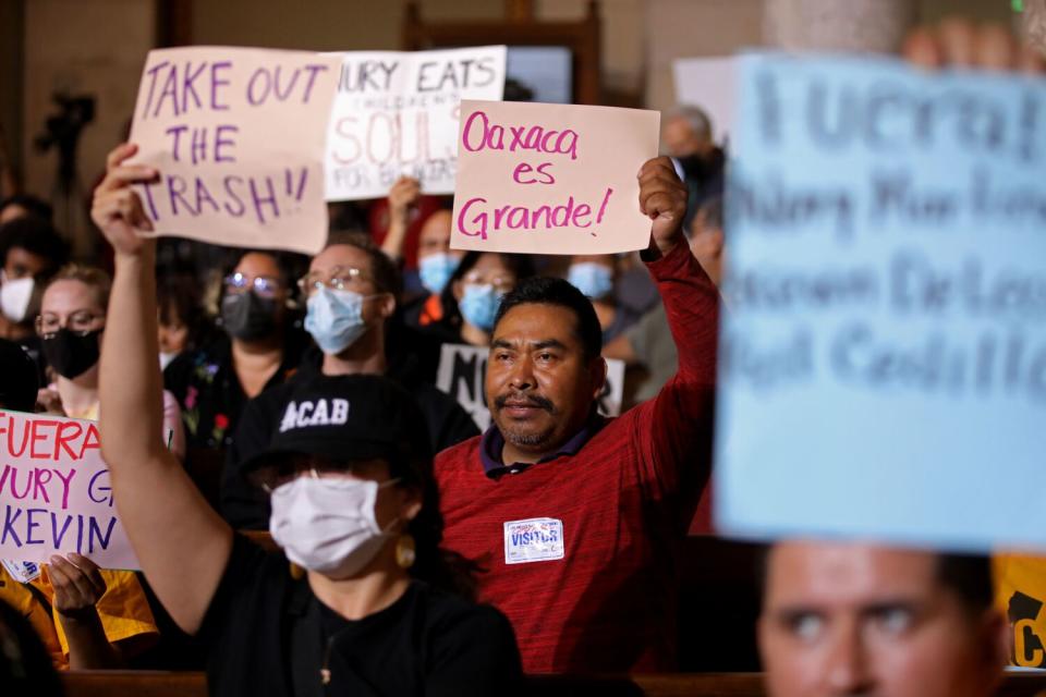 Protestors at the Los Angeles City Council meeting in the Council Chamber at Los Angeles City Hall.