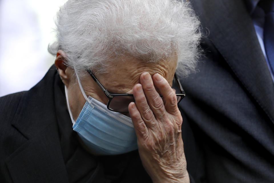 Salma Mershak, the mother of Lokman Slim, a well-known Lebanese publisher and vocal critic of Hezbollah group, reacts during a memorial service to pay tribute to her slain son, in the southern suburb of Beirut, Lebanon, Thursday, Feb. 11, 2021. Scores of friends and family members bid Slim farewell Thursday in a ceremony attended by western diplomats and organized in his home in the southern suburb of Beirut amid tight security. (AP Photo/Hussein Malla)