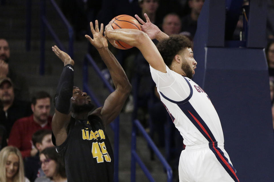 Gonzaga forward Anton Watson, right, grabs a rebound next to Arkansas-Pine Bluff forward Ismael Plet (45) during the first half of an NCAA college basketball game, Tuesday, Dec. 5, 2023, in Spokane, Wash. (AP Photo/Young Kwak)