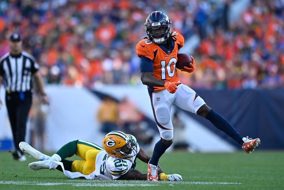 Jerry Jeudy #10 of the Denver Broncos runs with the ball after a reception in the fourth quarter of the game against the Green Bay Packers at Empower Field At Mile High on October 22, 2023 in Denver, Colorado.