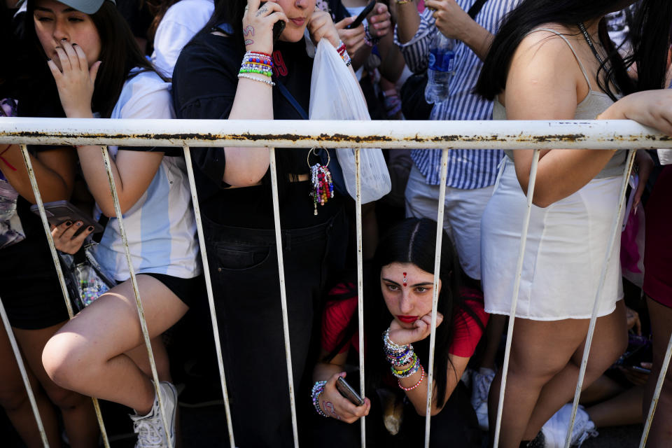 Fans of Taylor Swift wait for the doors of the Monumental stadium to open for her Eras Tour concert in Buenos Aires, Argentina, Thursday, Nov. 9, 2023. (AP Photo/Natacha Pisarenko)