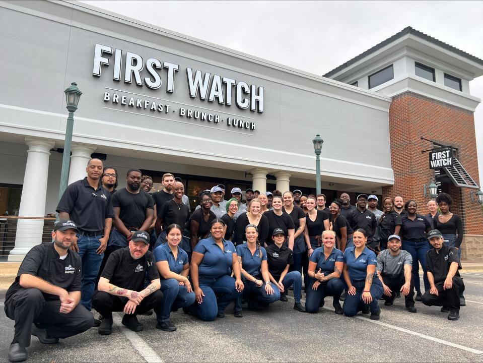 Employees prepare for the opening of First Watch on Eastchase Parkway.