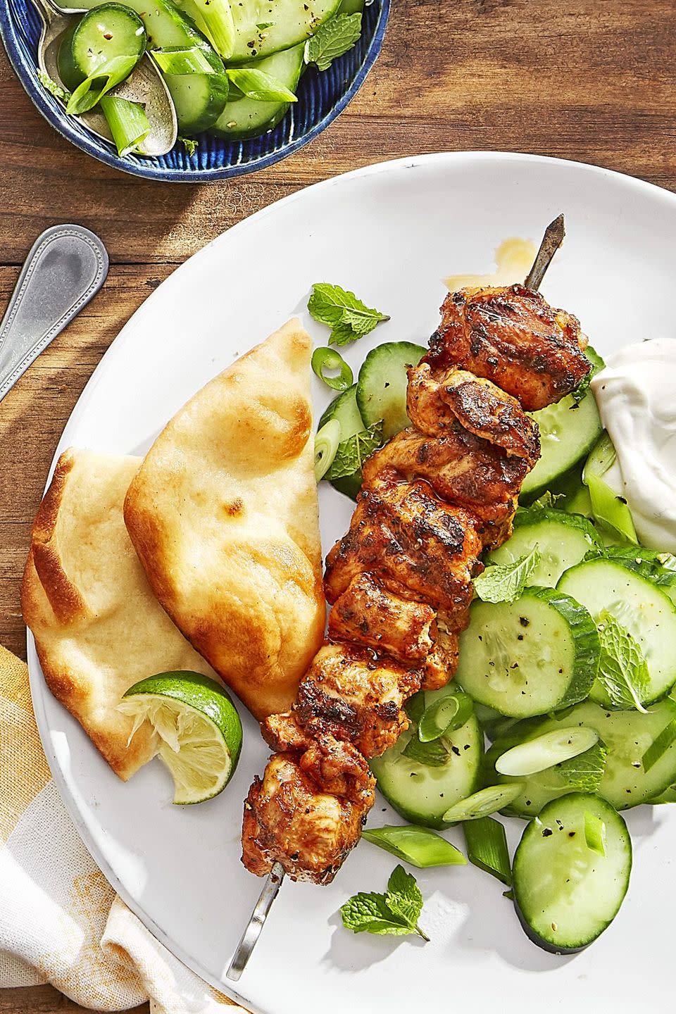 grilled spiced chicken skewers with cucumber salad