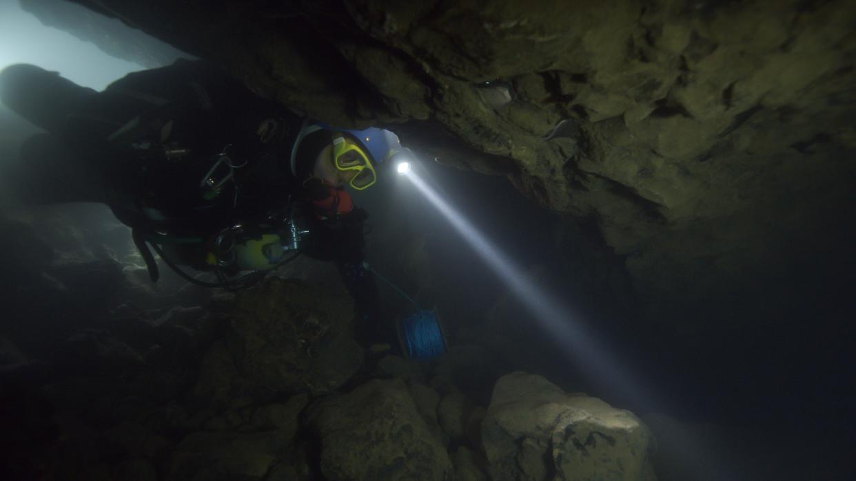 A diver navigates treacherous underwater terrain while on a life-saving mission in the documentary, The Rescue (Photo: National Geographic Documentary Films)