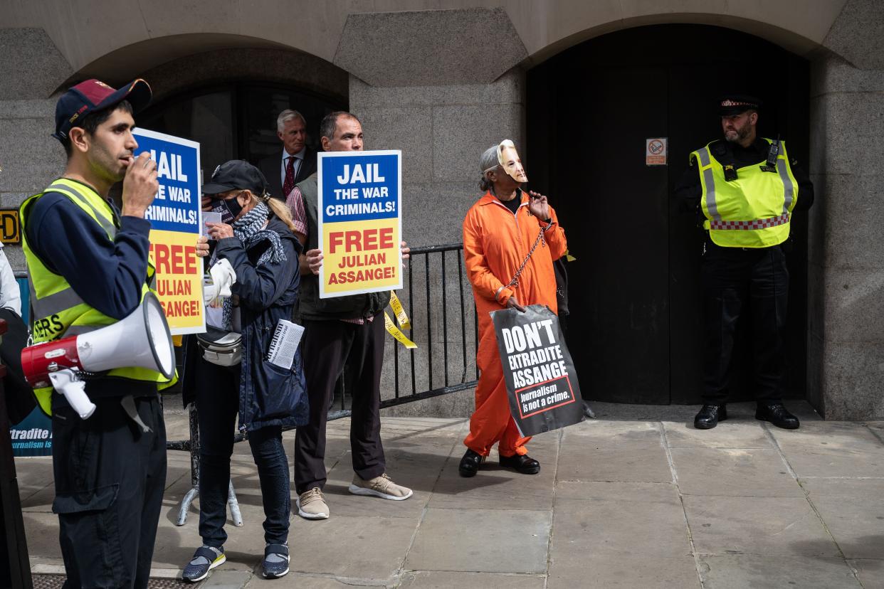 Supporters of Wikileaks founder Julian Assange gather outside the Old Bailey as he appears in court at the resumption of his extradition trial hearing on Sept. 7, 2020, in London, England.