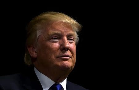 U.S. Republican presidential candidate Donald Trump waits to speak at a campaign town hall in Davenport, Iowa January 30, 2016. REUTERS/Rick Wilking