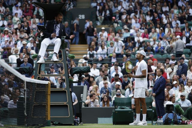 Nick Kyrgios speaks with the umpire after the second set 