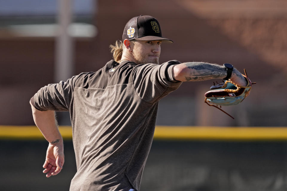 San Diego Padres relief pitcher Josh Hader participates in a drill during spring training baseball practice Saturday, Feb. 18, 2023, in Peoria, Ariz. (AP Photo/Charlie Riedel)