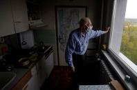 Petr Brandejsky, a 90-year-old Holocaust survivor, looks out of a window of his apartment in Prague