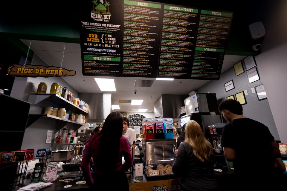 Customers order sandwiches at Cheba Hut "Toasted" Subs on their VIP party on Wednesday, Feb. 21, 2024. The new restaurant set to open on Feb. 23 is at 3001 N Zaragoza Road in East El Paso, TX.