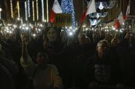 People stage a protest in La Valletta, Malta, Sunday, Dec. 1, 2019. Malta's embattled prime minister has received a pledge of confidence from Labor Party lawmakers amid demands for his resignation by citizens angry over alleged links of his former top aide to the car bomb killing of a Maltese anti-corruption journalist. Hours later, thousands of Maltese protested outside a courthouse demanding that Joseph Muscat step down. (AP Photo)