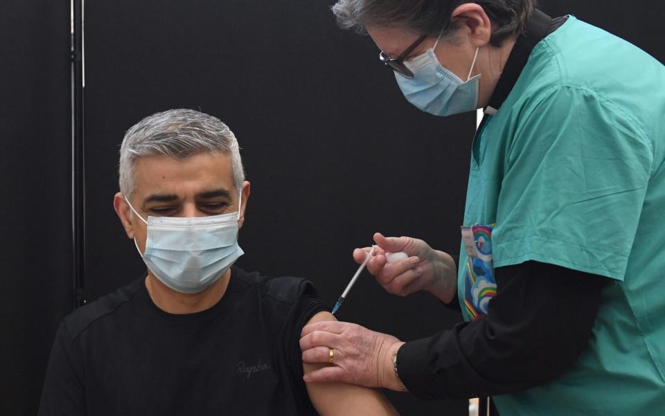Mayor of London Sadiq Khan receives his first dose of the coronavirus vaccine, administered by Dr Sue Clarke - Stefan Rousseau/PA