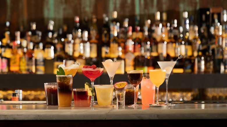 Several cocktails on the bar counter