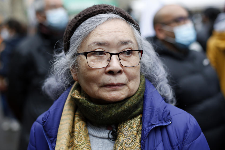 Tran To Nga, a 78-year-old former journalist, attends a gathering in support of people exposed to Agent Orange during the Vietnam War, in Paris, Saturday Jan. 30, 2021. Activists gathered Saturday in Paris in support of people exposed to Agent Orange during the Vietnam War, after a French court examined a case opposing a French-Vietnamese woman to 14 companies that produced and sold the toxic chemical. (AP Photo/Thibault Camus)