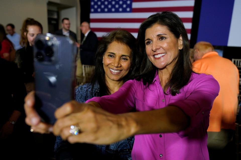 Republican presidential candidate Nikki Haley poses for a photo with Rajshri Agarwal, of Ames, Iowa, left, during a town hall campaign event, Wednesday, May 17, 2023, in Ankeny, Iowa. (AP Photo/Charlie Neibergall)