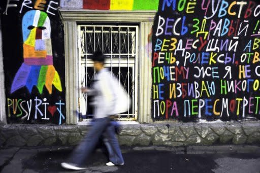 A man walks past a grafitti in support of a punk band "Pussy Riot" in central Moscow on August 12. Russian police on Wednesday arrested four activists who demonstrated outside a landmark Moscow church in support of members of protest punk band Pussy Riot who are now on trial