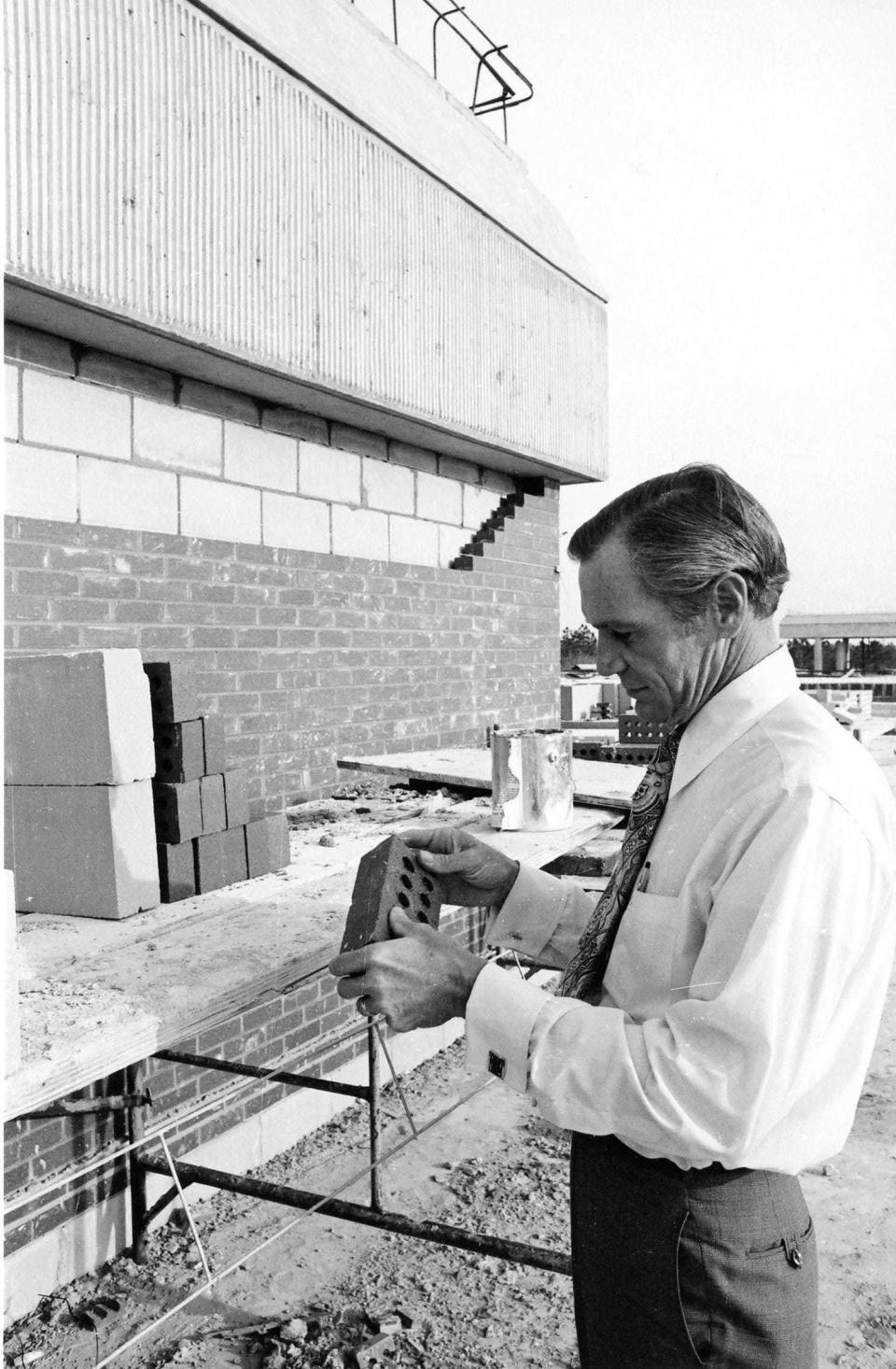 University of North Florida President Thomas G. Carpenter oversees construction of his new campus in 1972.