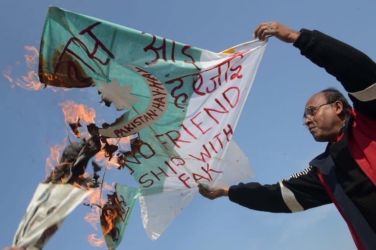 Indian kite maker Jagmohan Kanojia burns a kite in the colours of the Pakistani national flag as he protests in Amritsar on January 10, 2013, over the killing of two Indian soldiers. Pakistan said one of its soldiers was killed Thursday by "unprovoked" Indian firing across their tense border in Kashmir, the third deadly incident reported in five days in the disputed region