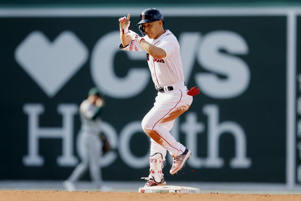 Boston Red Sox's Masataka Yoshida reacts after hitting a ground-rule double during the fourth inning of a baseball game against the Oakland Athletics, Saturday, July 8, 2023, in Boston. (AP Photo/Michael Dwyer)
