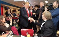 <p>Trump greets patrons during a stop at the Roundabout Diner, April 27, 2011, in Portsmouth, N.H. <i>(Photo: Jim Cole/AP)</i> </p>