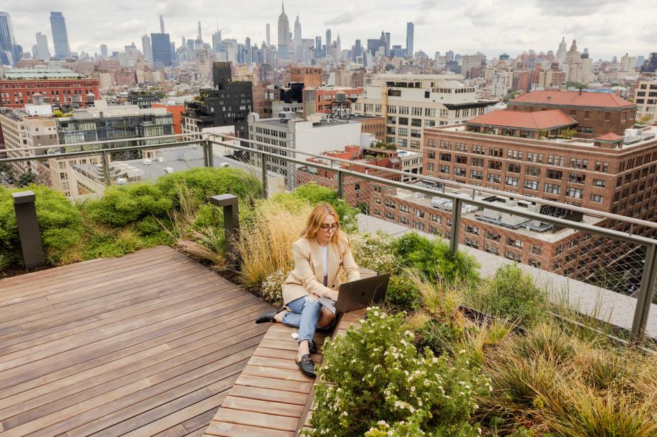 The rooftop which has views of the city skyscrapers