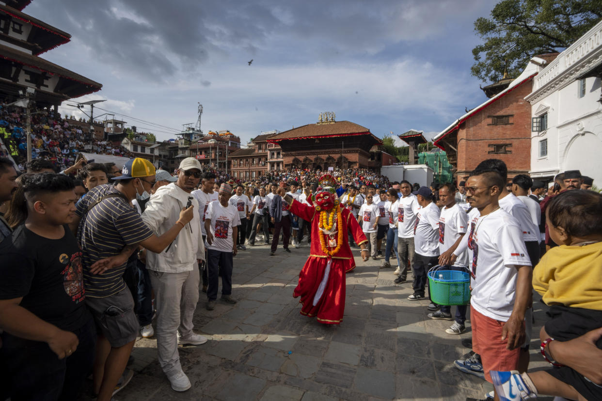 Masked dancers perform during Indra Jatra, a festival that marks the end of the rainy season in Kathmandu, Nepal, Tuesday, Sept. 17, 2024. (AP Photo/Niranjan Shrestha)