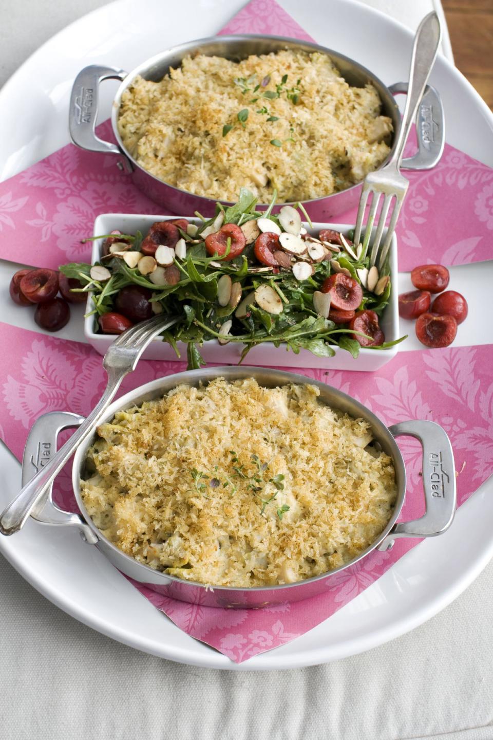 In this image taken on Jan. 21, 2013, crab and hearts of palm gratin with arugula and cherry salad are shown in Concord, N.H. (AP Photo/Matthew Mead)