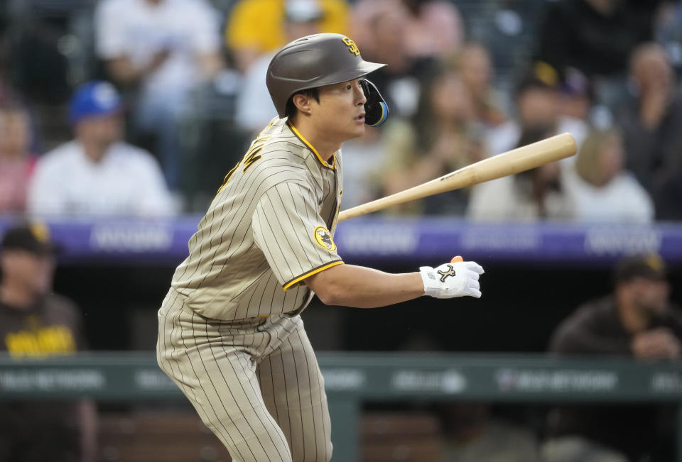 San Diego Padres' Ha-Seong Kim follows the flight of his RBI-single off Colorado Rockies starting pitcher Austin Gomber in the fifth inning of a baseball game Friday, June 9, 2023, in Denver. (AP Photo/David Zalubowski)