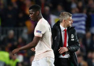 Soccer Football - Champions League Quarter Final Second Leg - FC Barcelona v Manchester United - Camp Nou, Barcelona, Spain - April 16, 2019 Manchester United's Paul Pogba with manager Ole Gunnar Solskjaer after the match REUTERS/Sergio Perez