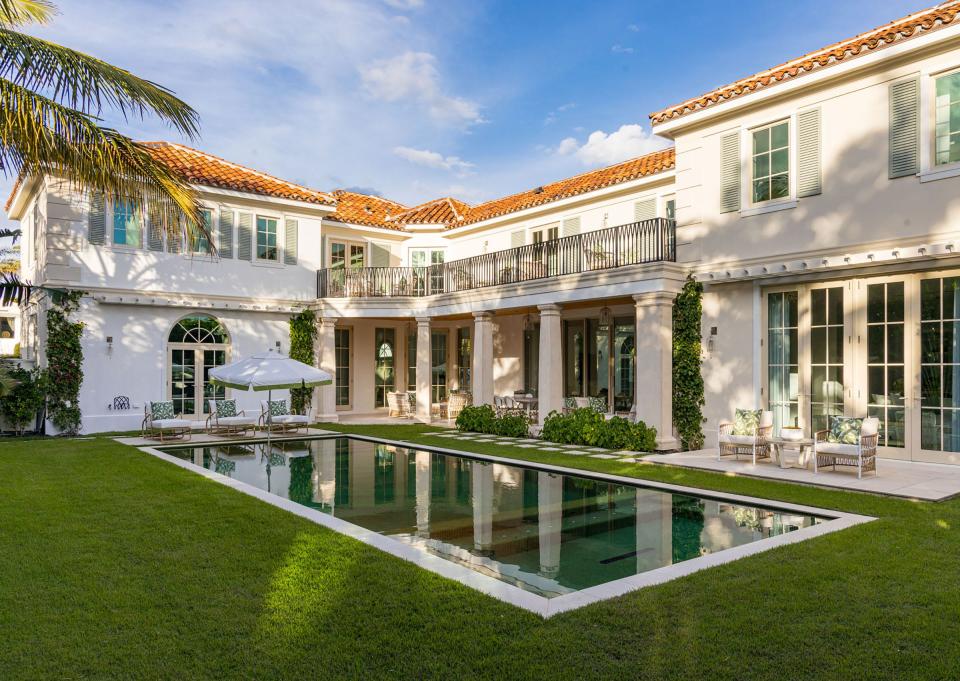 The two wings wrap around the pool area of a house developed on speculation at 1080 S. Ocean Blvd. in Palm Beach. The ocean-view property just sold for a recorded $21.8 million to a trust.