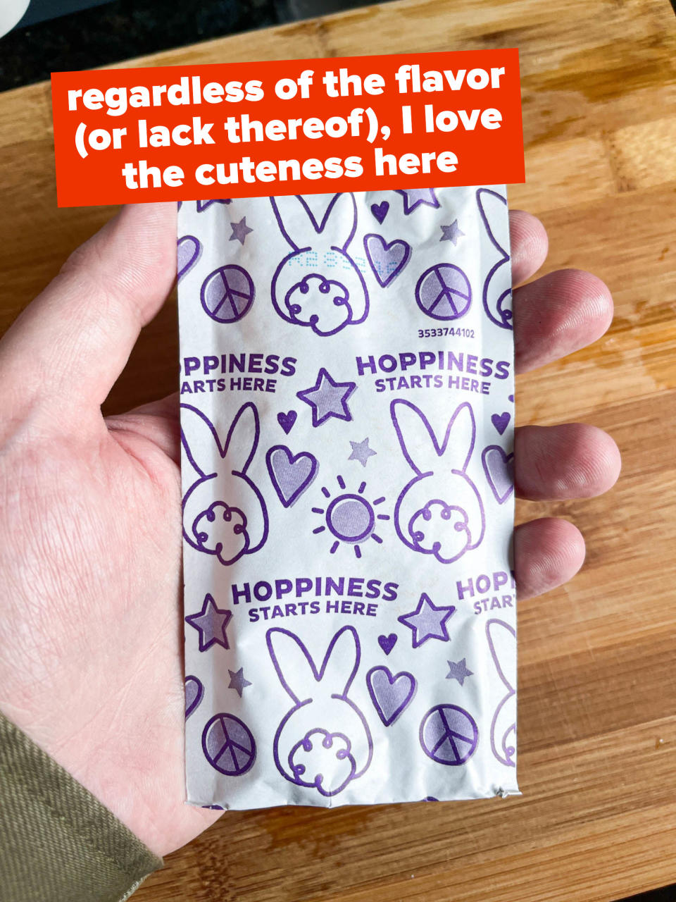 Cute-looking cheese packet in the author's hand with bunnies on it and "hoppiness starts here", with text "regardless of the flavor, I loved the cuteness here"