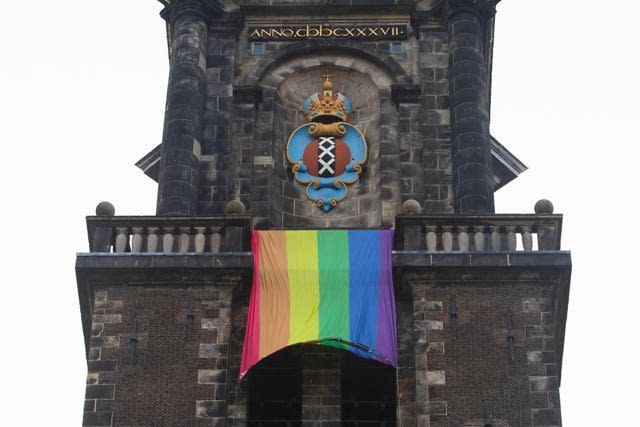 A large rainbow flag flies from the bell tower of Wester Church to mark the 20th anniversary of the first legalised same-sex marriage in Amsterdam, Netherlands 