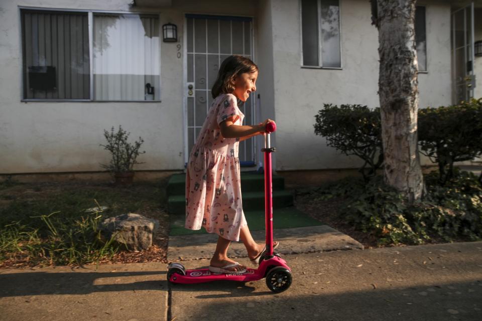 Aqsa Sadat rides a scooter