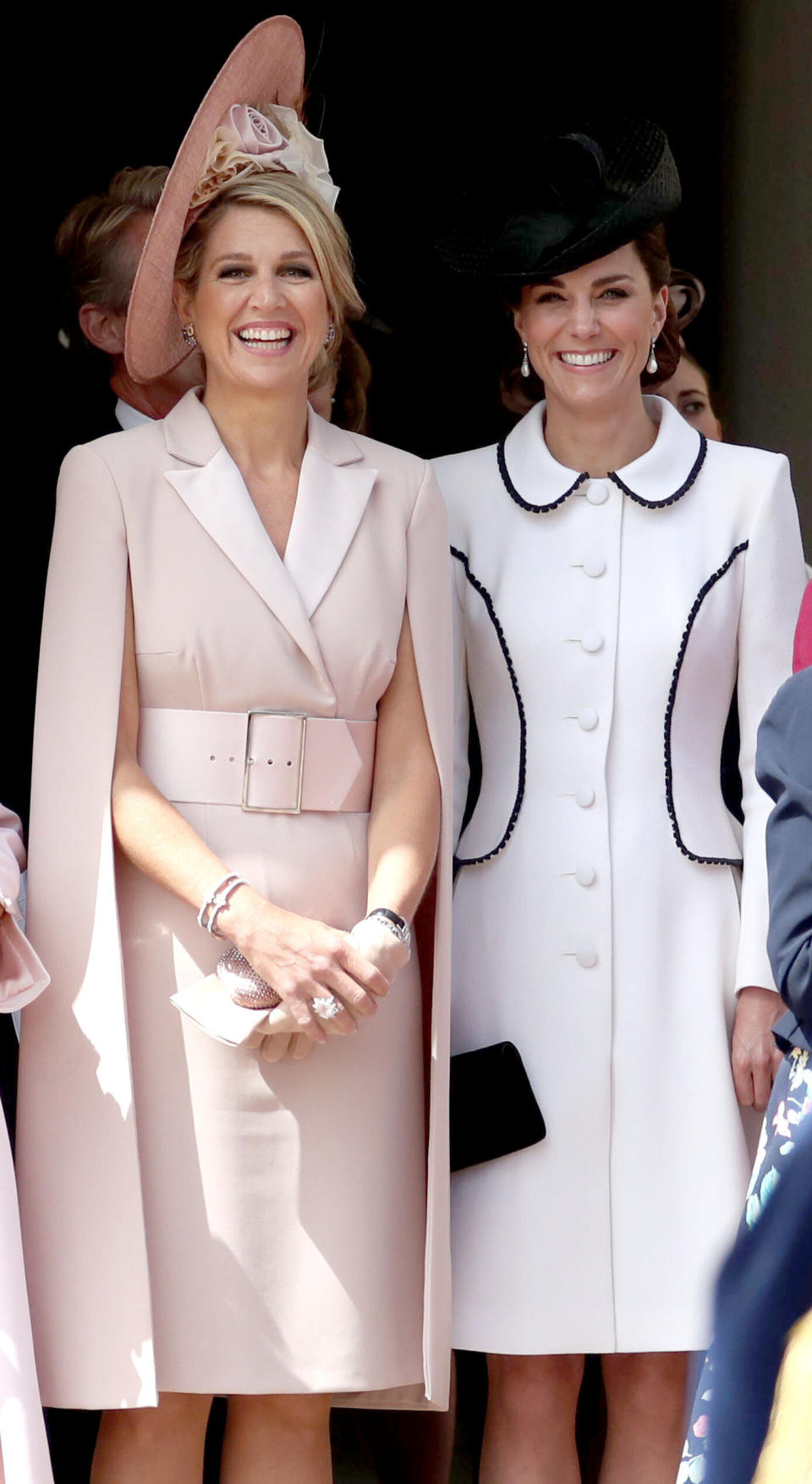 The Netherlands' Queen Maxima and Catherine, Duchess of Cambridge watch the procession to St. George's Chapel. (Photo: STEVE PARSONS via Getty Images)