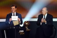 ZURICH, SWITZERLAND - JANUARY 07: Fabio Cannavaro (L) and Joseph Blatter, FIFA president (R) announce Lionel Messi of Argentina as the winner of the FIFA Ballon d'Or 2012 trophy on January 7, 2013 in Zurich, Switzerland. (Photo by Christof Koepsel/Getty Images)